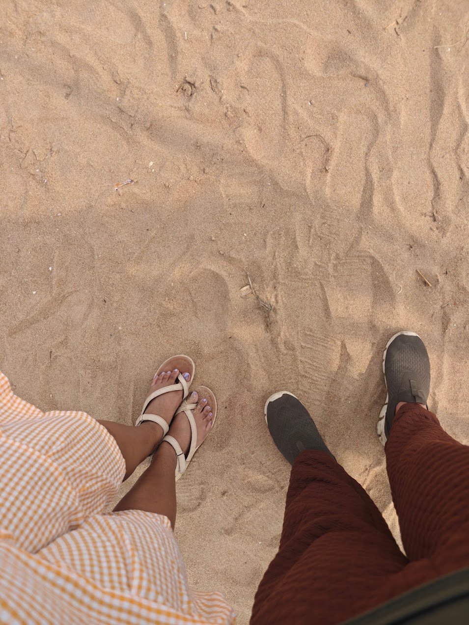 Our feet on the sand